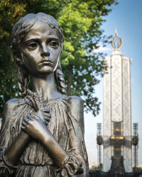 Metal statue of a girl from holodomor monument memorial in kiev, ukraine