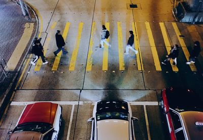 High angle view of people crossing road