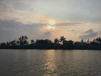 Scenic view of lake against sky during sunset