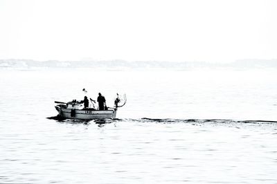 People on boat in lake