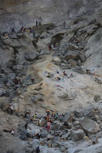 High angle view of people on rocks