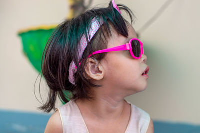 Close-up of girl wearing sunglasses