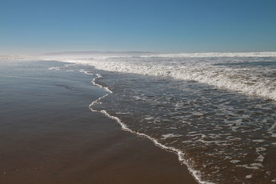 Scenic view of sea against clear sky