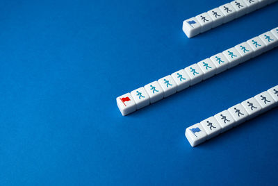 Close-up of thermometer on blue background