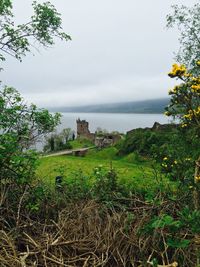 Scenic view of sea against cloudy sky