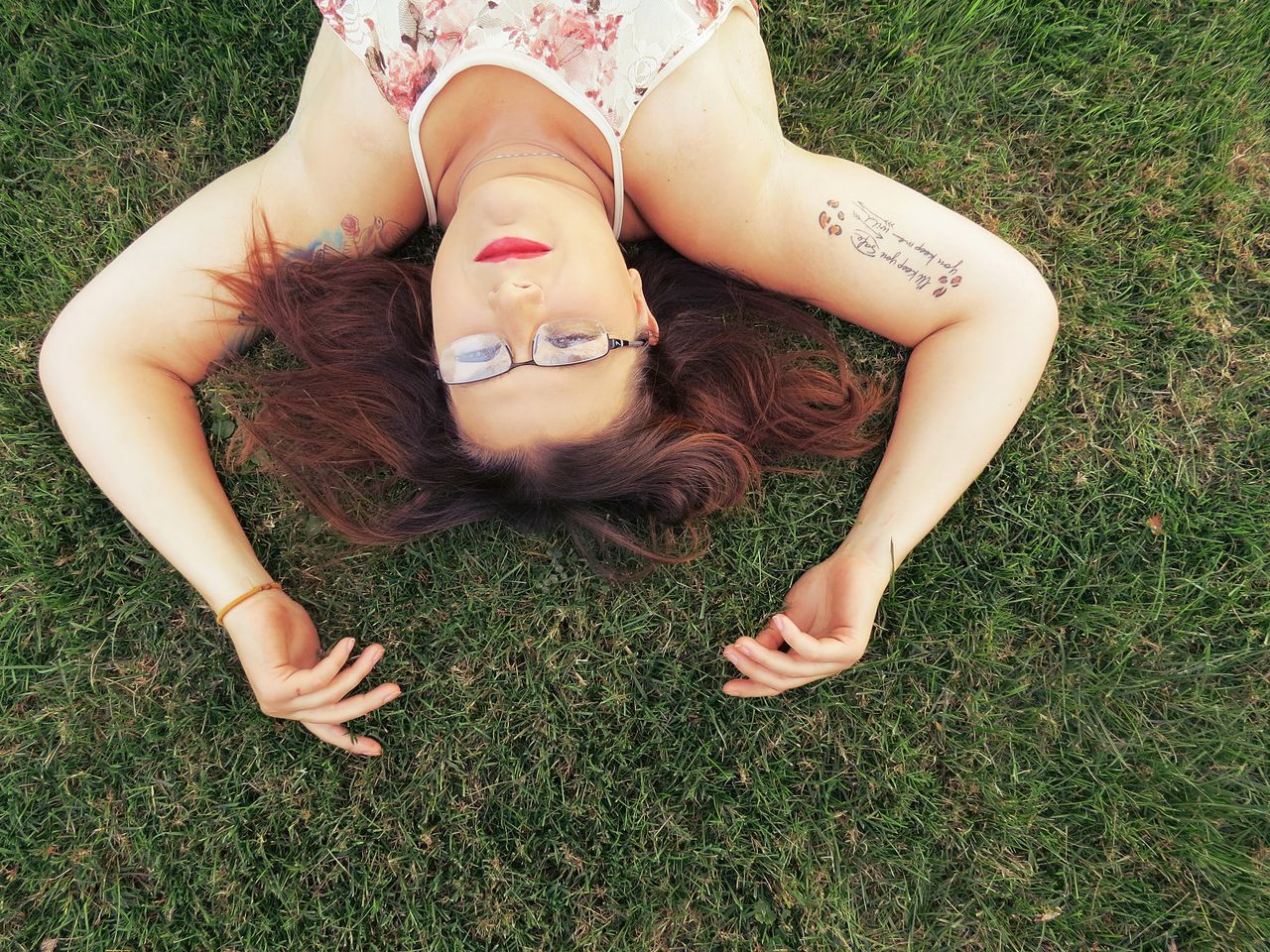 eyes closed, only women, grass, lying down, adults only, one woman only, adult, one person, people, women, day, young adult, outdoors, one young woman only