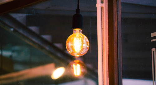 Close-up of illuminated light bulb