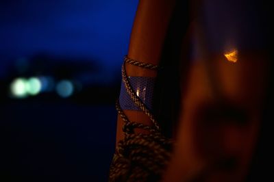 Close-up of rope on wood at night