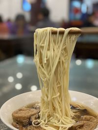 Close-up of ice cream in bowl on table at restaurant