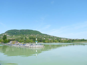 Scenic view of lake against blue sky