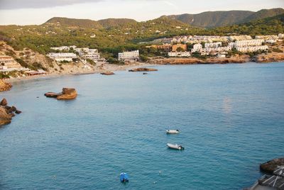 High angle view of townscape by sea