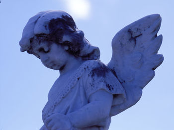 Low angle view of statue against sky