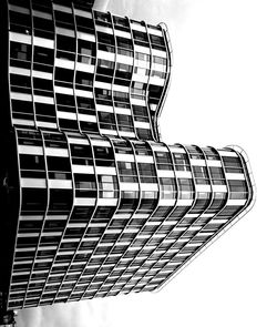 Low angle view of office building against sky