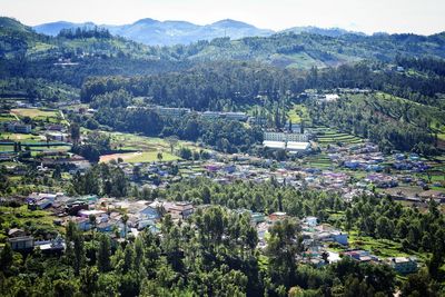 High angle view of townscape and mountains