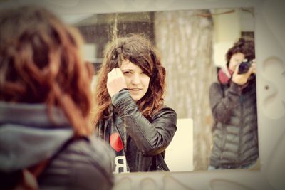 Reflection of woman in mirror