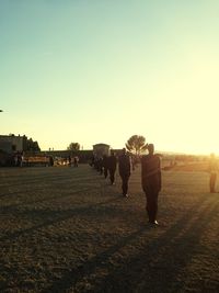 Silhouette of woman against clear sky