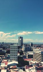 Cityscape against blue sky