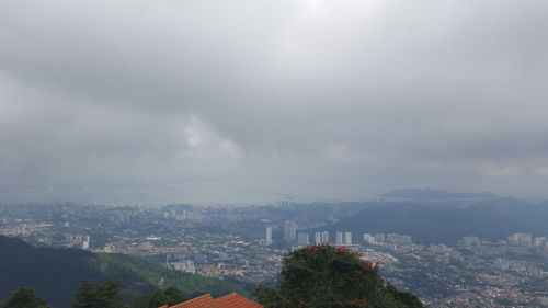 High angle view of buildings in city against sky