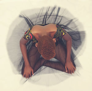 Close-up of girl relaxing on bed at home