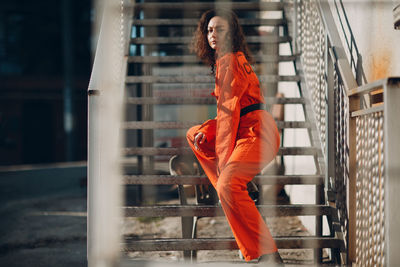 Portrait of young woman standing in gym