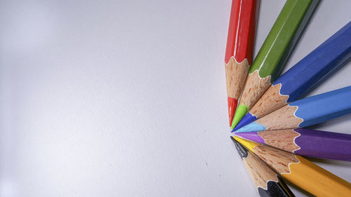 Close-up of multi colored pencils on table