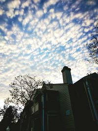 Low angle view of building against cloudy sky