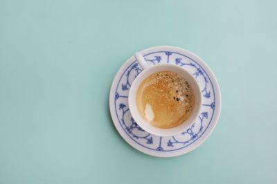 Directly above shot of coffee on blue background