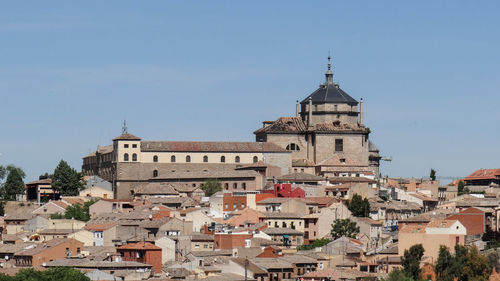 View of buildings in city against sky