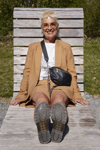 Mature woman relaxing on sun lounger
