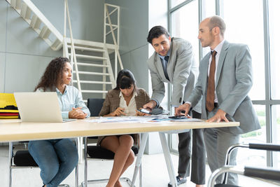 Business colleagues discussing at office