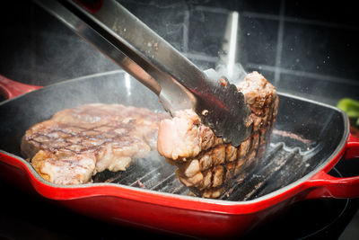 Close-up of meat cooking on barbecue grill