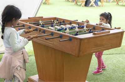 Girls playing foosball