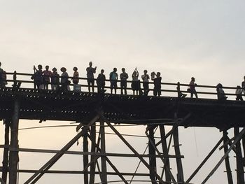 Low angle view of people against sky