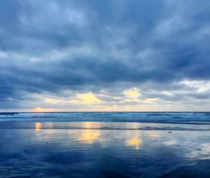 Scenic view of sea against cloudy sky