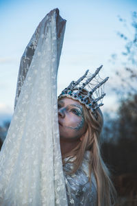 Woman wearing costume while standing outdoors