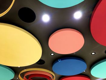 Low angle view of illuminated lights in ceiling