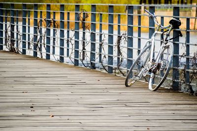 Bicycles on footpath by wall