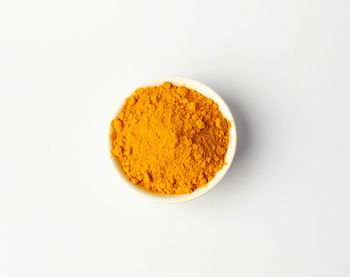 High angle view of bread in plate against white background