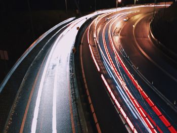 High angle view of light trails on roads at night