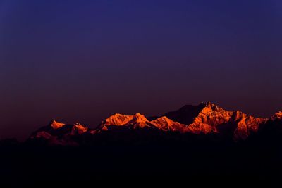 Scenic view of mountain against sky at night