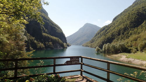 Scenic view of river with trees in background