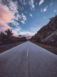 Surface level of empty road against sky