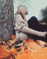 Woman in autumn tree