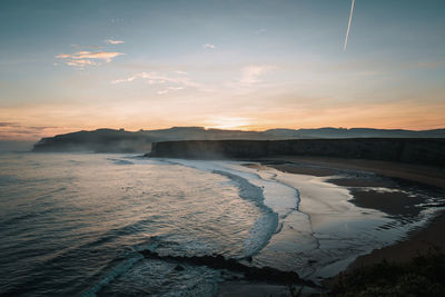 Scenic view of sea against sky during sunset