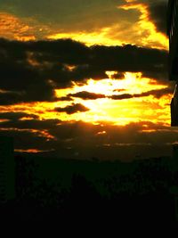 Scenic view of dramatic sky during sunset