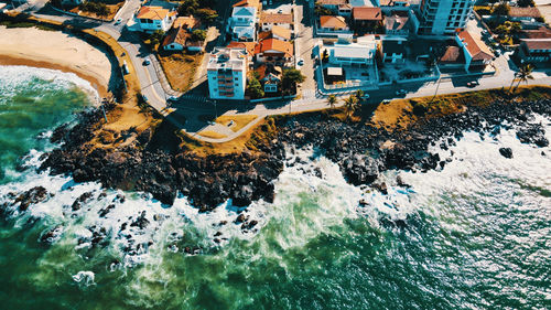 High angle view of city by sea