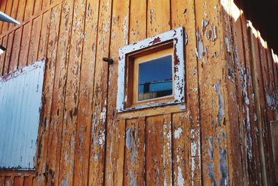 Low angle view of window on old building