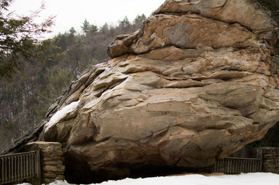 Low angle view of rock formation against sky