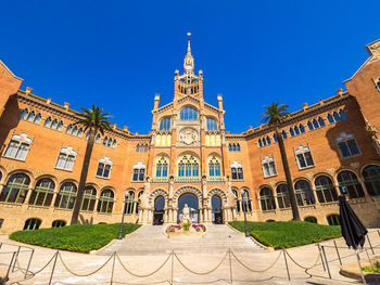 Low angle view of building against blue sky