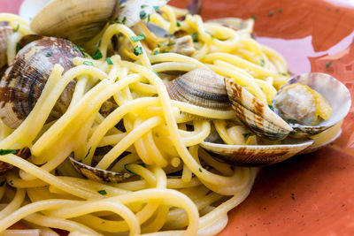 Close-up of spaghetti with clams served in plate